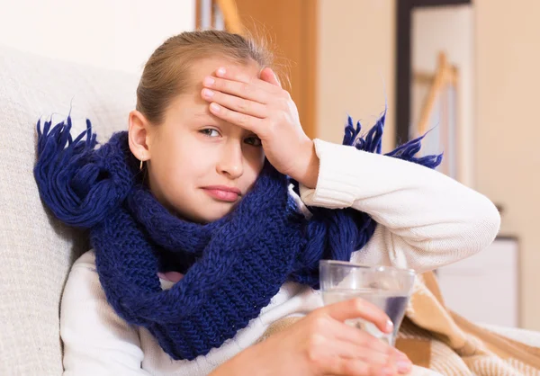 Girl in warm scarf drinking — Stock Photo, Image