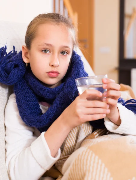 Girl in warm scarf drinking — Stock Photo, Image