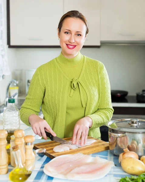 Housewife cooking fish soup — Stock Photo, Image