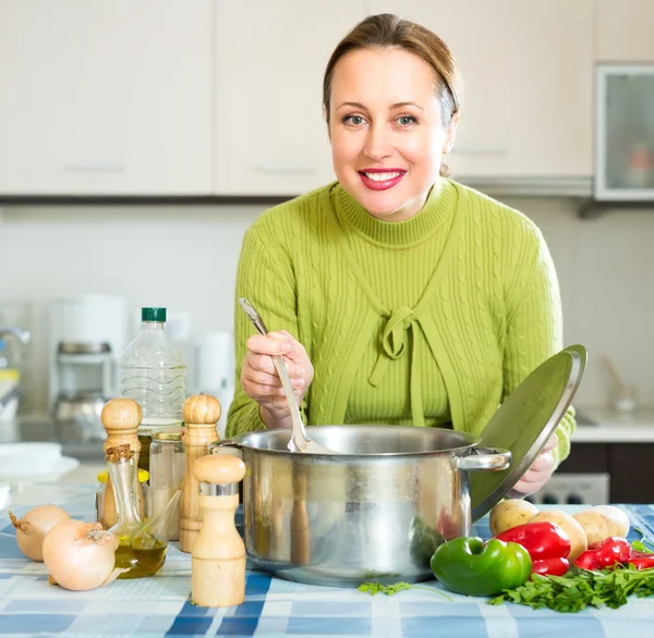 Female cooking healthy soup — Stock Photo, Image