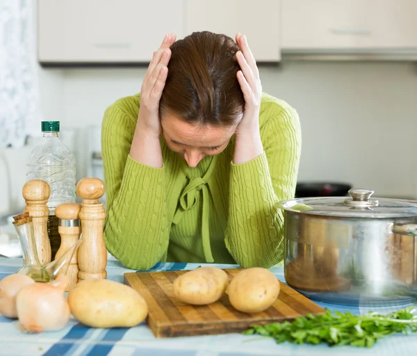 Tired housewife at kitchen — Stock Photo, Image