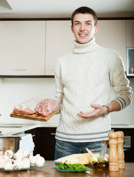Guy cooking meat — Stock Photo, Image