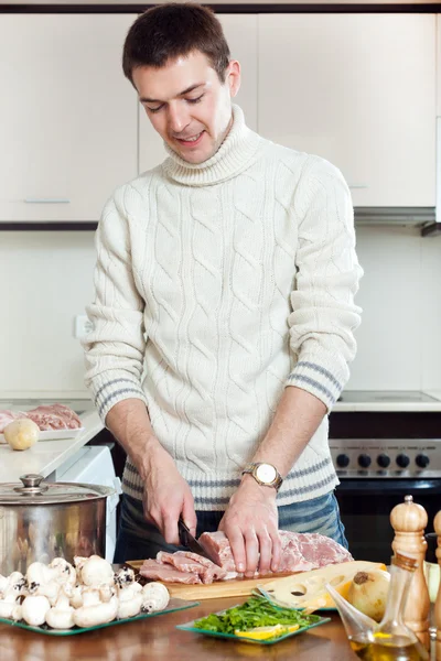 Ordinary man Cooking french-style veal — Stock Photo, Image