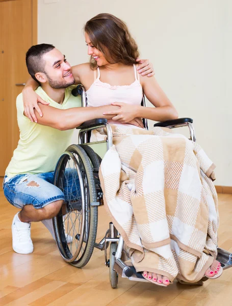 Happy couple with disabled spouse — Stock Photo, Image