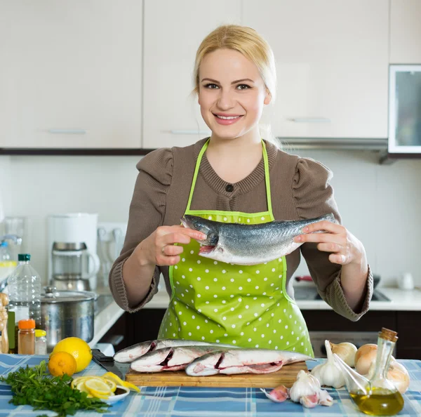 Happy ukrainian woman with fish — Stock Photo, Image