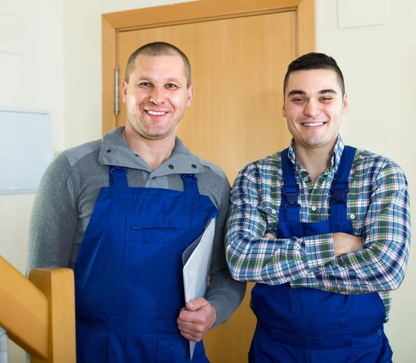 Happy professional workers in uniform — Stock Photo, Image