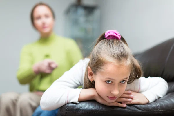 Woman berating daughter in home — Stock Photo, Image
