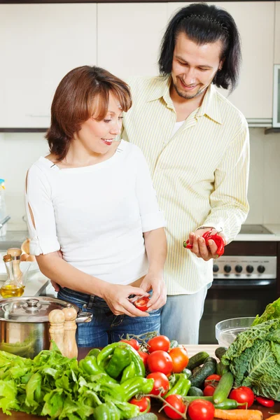 Flirting couple cooking together — Stock Photo, Image