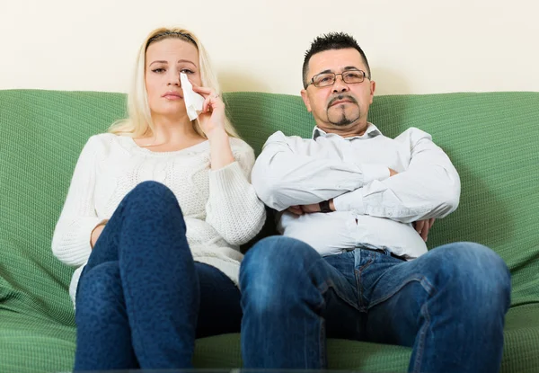 Sad man and unhappy woman at home — Stock Photo, Image