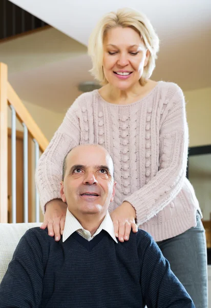 Wife massaging neck to husband — Stock Photo, Image