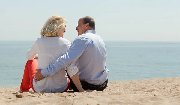 Mature couple at sand beach — Stock Photo, Image