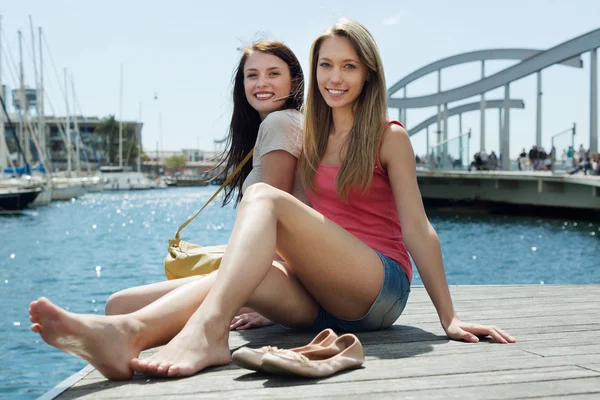 Two young girls  on the sea — Stock Photo, Image