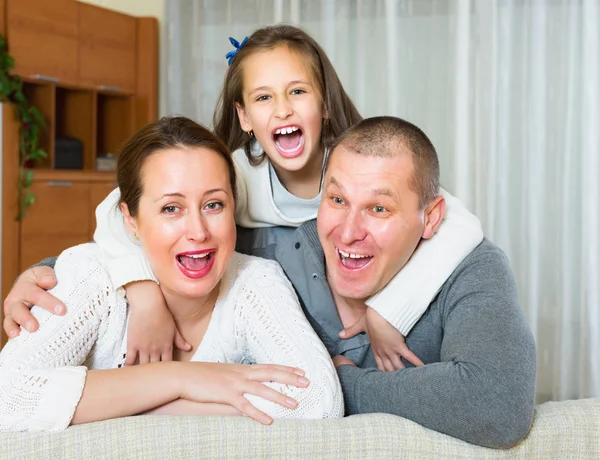 Little girl with happy parents — Stock Photo, Image