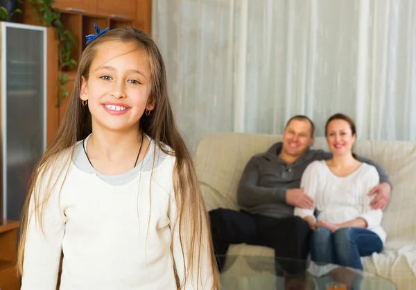 Happy little girl with parents — Stock Photo, Image