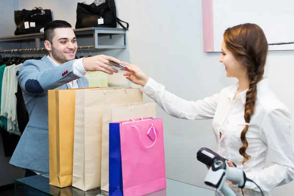 Store clerk serving purchaser Stock Image