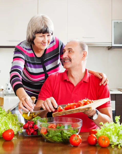 Mature couple cooking  together — Stock Photo, Image