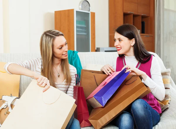 Girls together looking purchases — Stock Photo, Image