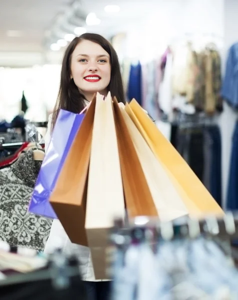 Girl with bags at store — Stock Photo, Image