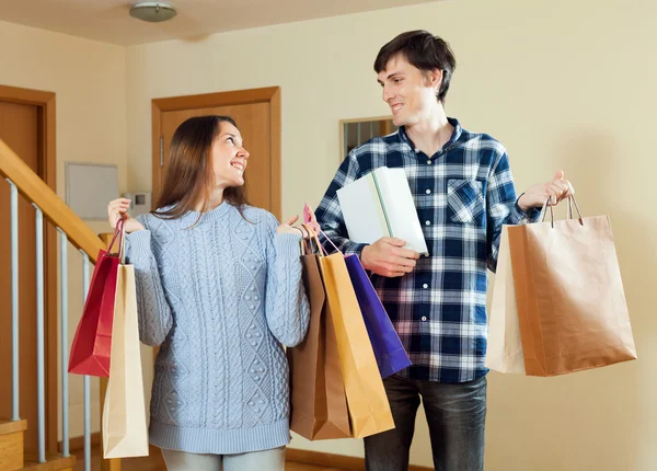 Couple together with bagsafter shopping — Stock Photo, Image