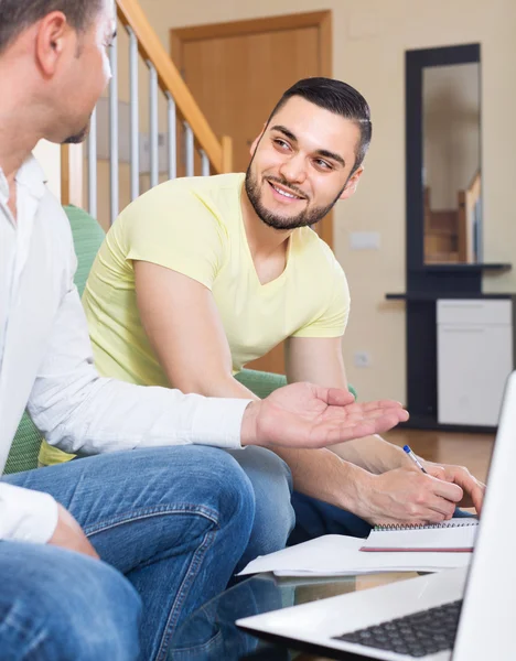 Two adult men with laptop indoor — Stock Photo, Image