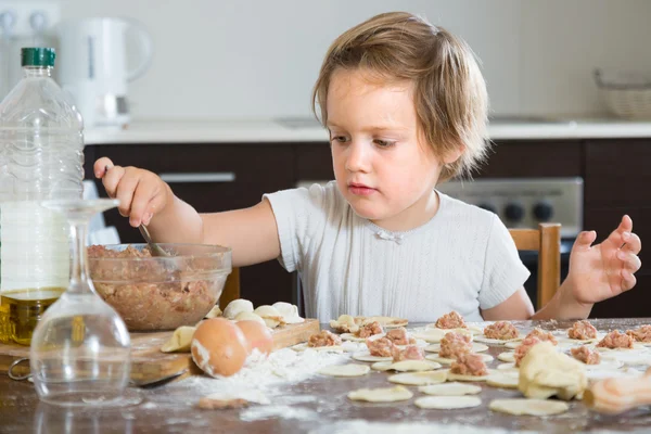 Child cooking meat dumplings — Stock Photo, Image