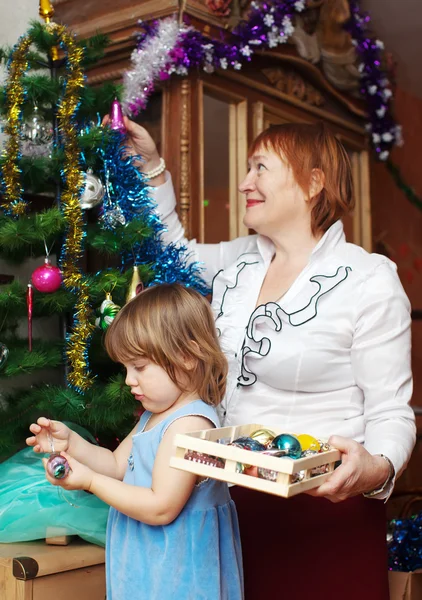 Grandmother and child preparing for Christmas — Stock Photo, Image
