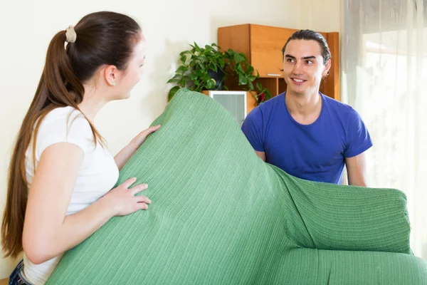 Couple doing relocation of furniture — Stock Photo, Image