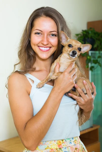 Girl with russian toy terrier — Stockfoto