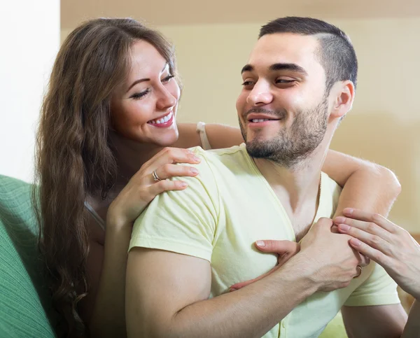 Happy young couple in home interior — Stock Photo, Image