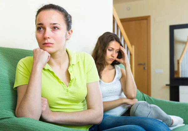 Women sitting on sofa after quarrel — Stock Photo, Image