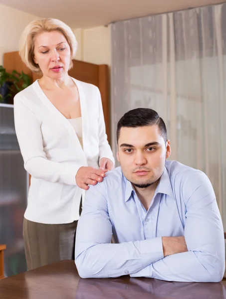 Conflict of aged woman and young guy — Stock Photo, Image