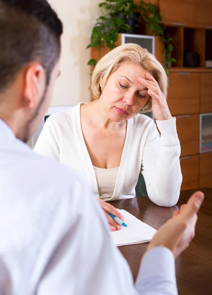 Woman and young man with bill — Stock Photo, Image