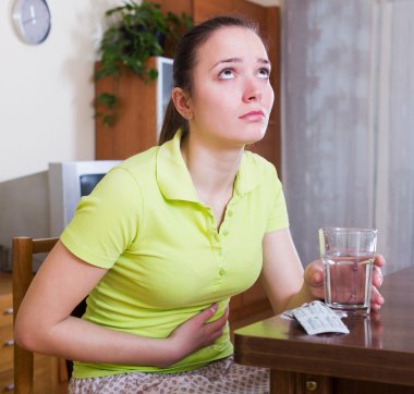 Unhappy woman having stomach aches clipart