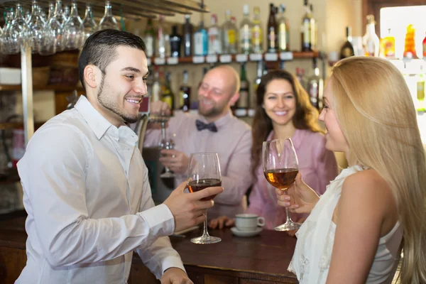 Couple drinking wine at bar — Stock Photo, Image