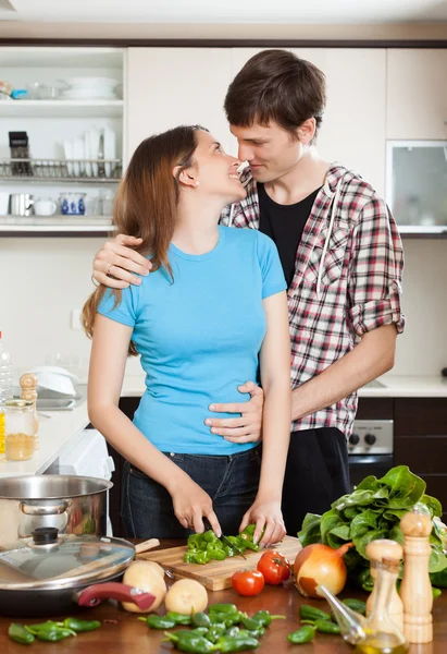 Young couple having flirt at kitchen — Stock Photo, Image