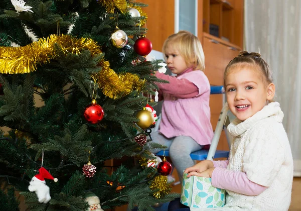 Little girls with Christmas tree — Stock Photo, Image