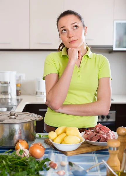 Young housewife ife at kitchen — Stock Photo, Image