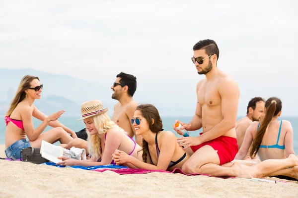 Group of people resting on beach