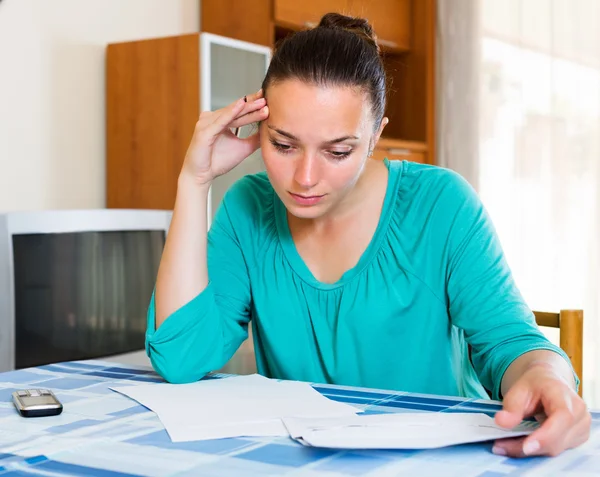 Sad woman with papers — Stock Photo, Image