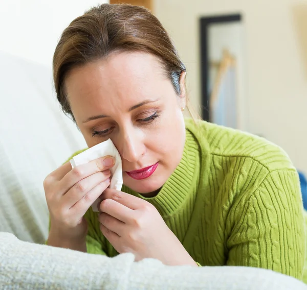 Crying lonely woman on sofa — Stock Photo, Image