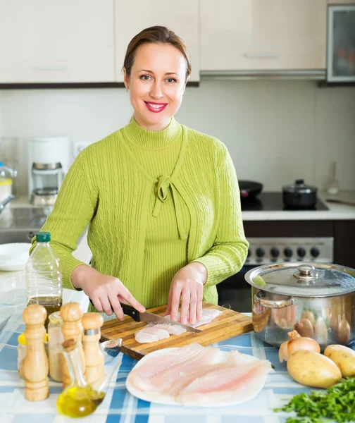 Housewife cooking fish soup — Stock Photo, Image