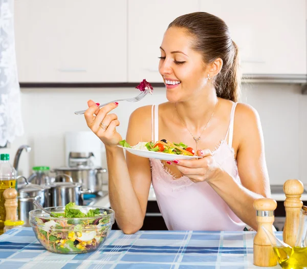 Positive female eating healthy salad — Stock Photo, Image