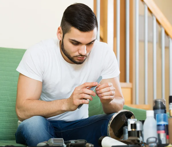 Man using nail file — Stock Photo, Image