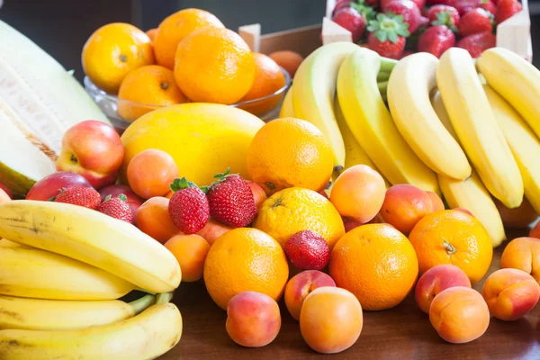 Fresh fruits at table — Stock Photo, Image