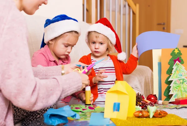 Woman with girls preparing for Christmas — Stock Photo, Image