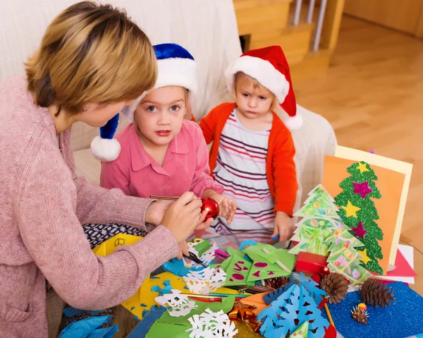 Mother with daughters doing applique work — Stock Photo, Image