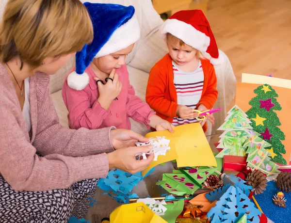 Mother with daughters doing applique work — Stock Photo, Image