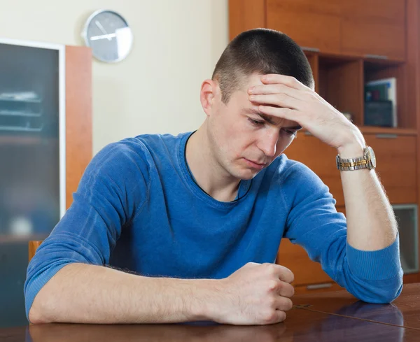 Unhappy guy in home — Stock Photo, Image
