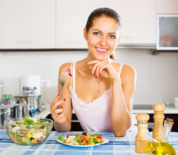 Positive female eating healthy salad — Stock Photo, Image