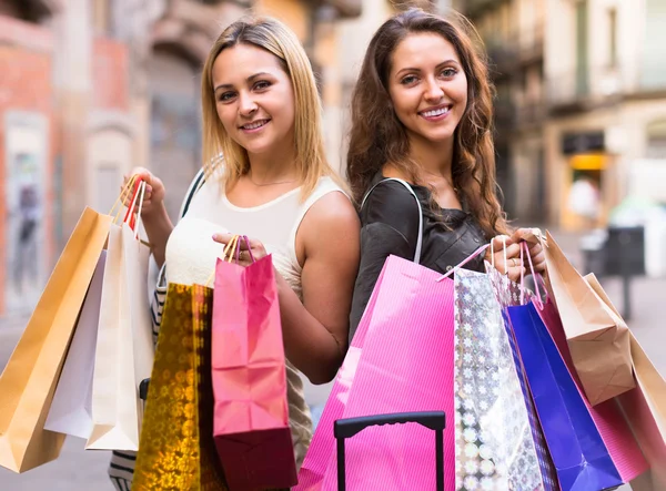 Girls with shopping bags at street — Stock Photo, Image